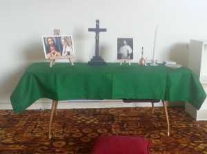 Our prayer table. We still need a Bible on a stand or cushion. 